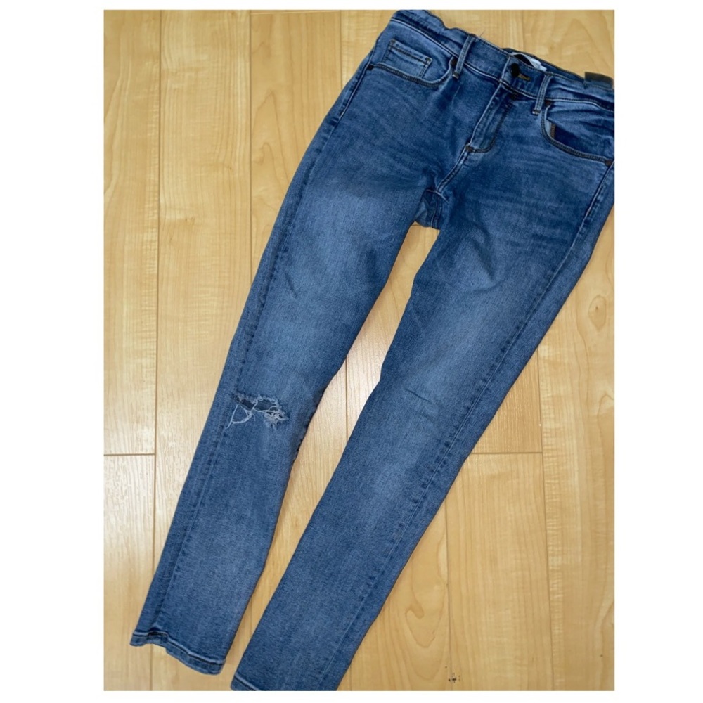 Rip blue jeans